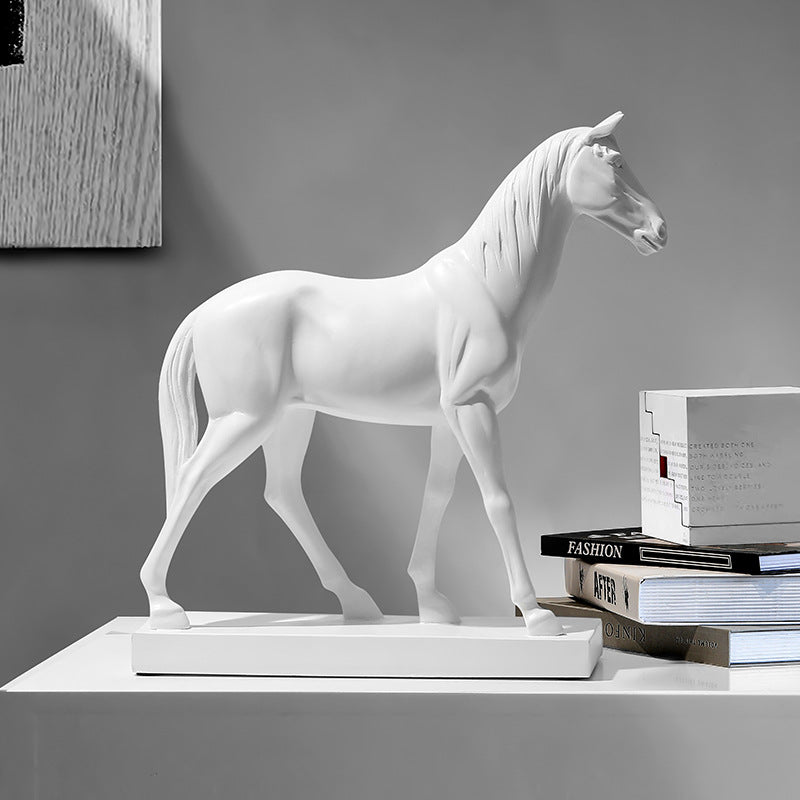 Side view of large white resin horse statue