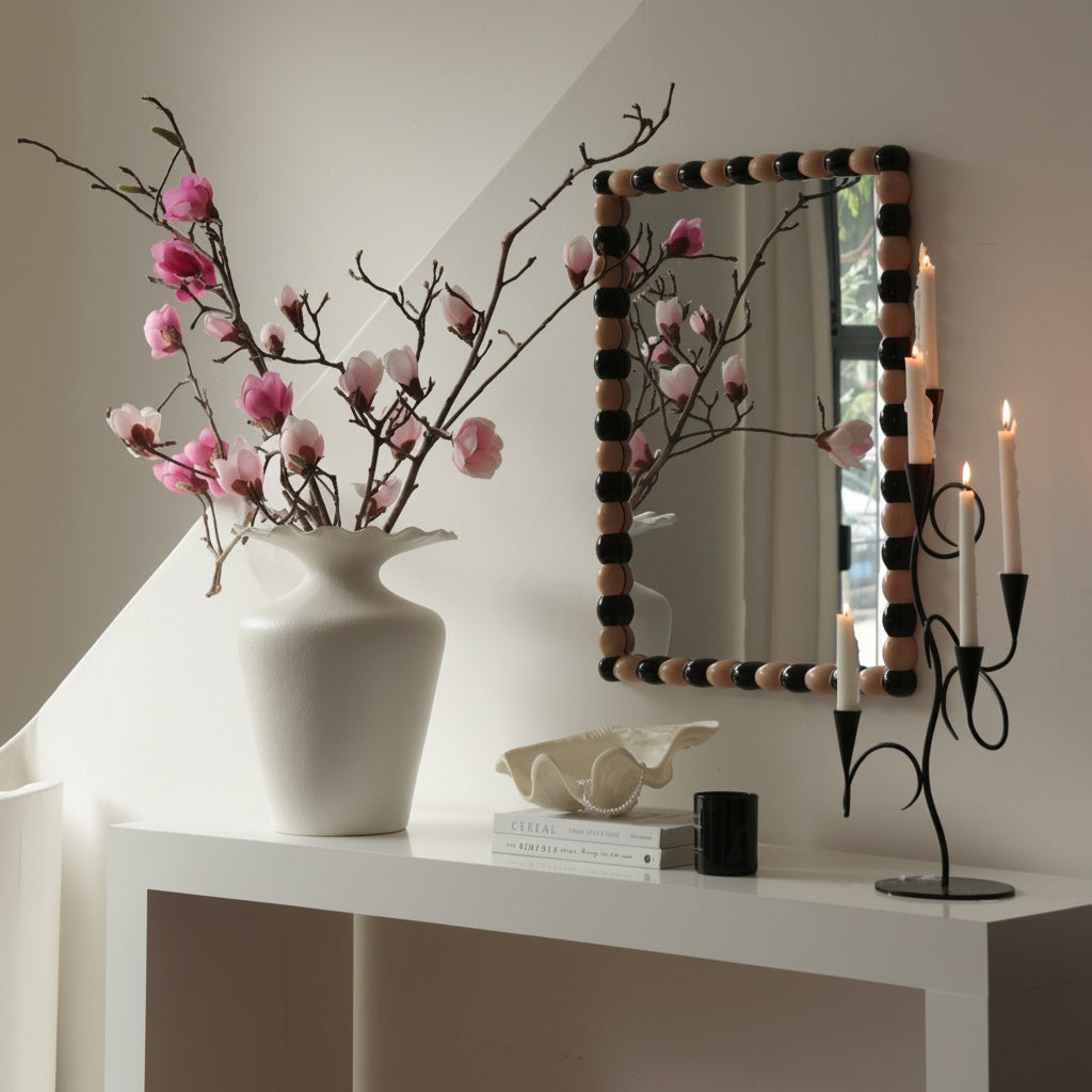 Matte white scalloped ceramic vase on a console table