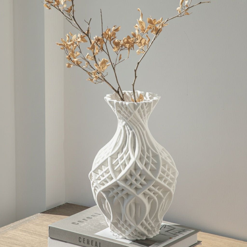 Matte white sculptural vase with dried botanicals