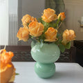 Mint green double sphere vase with orange roses