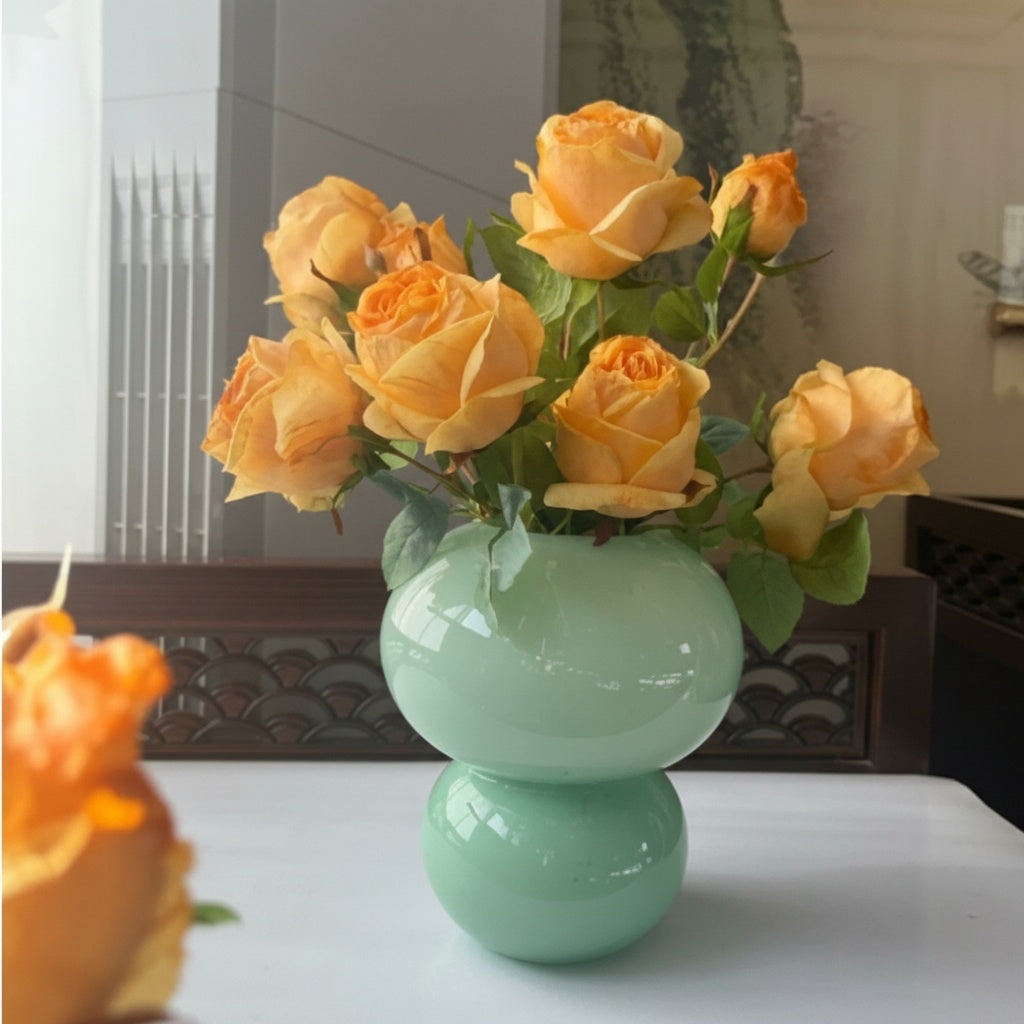 Mint green double sphere vase with orange roses