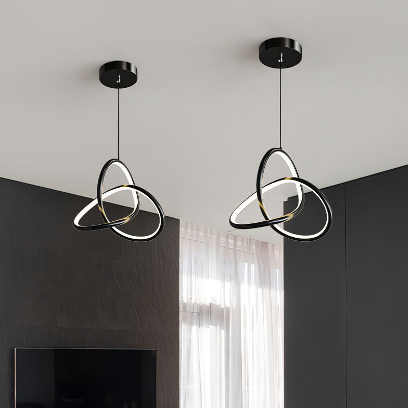 Black finish interlocking loop LED pendant light hanging from ceiling