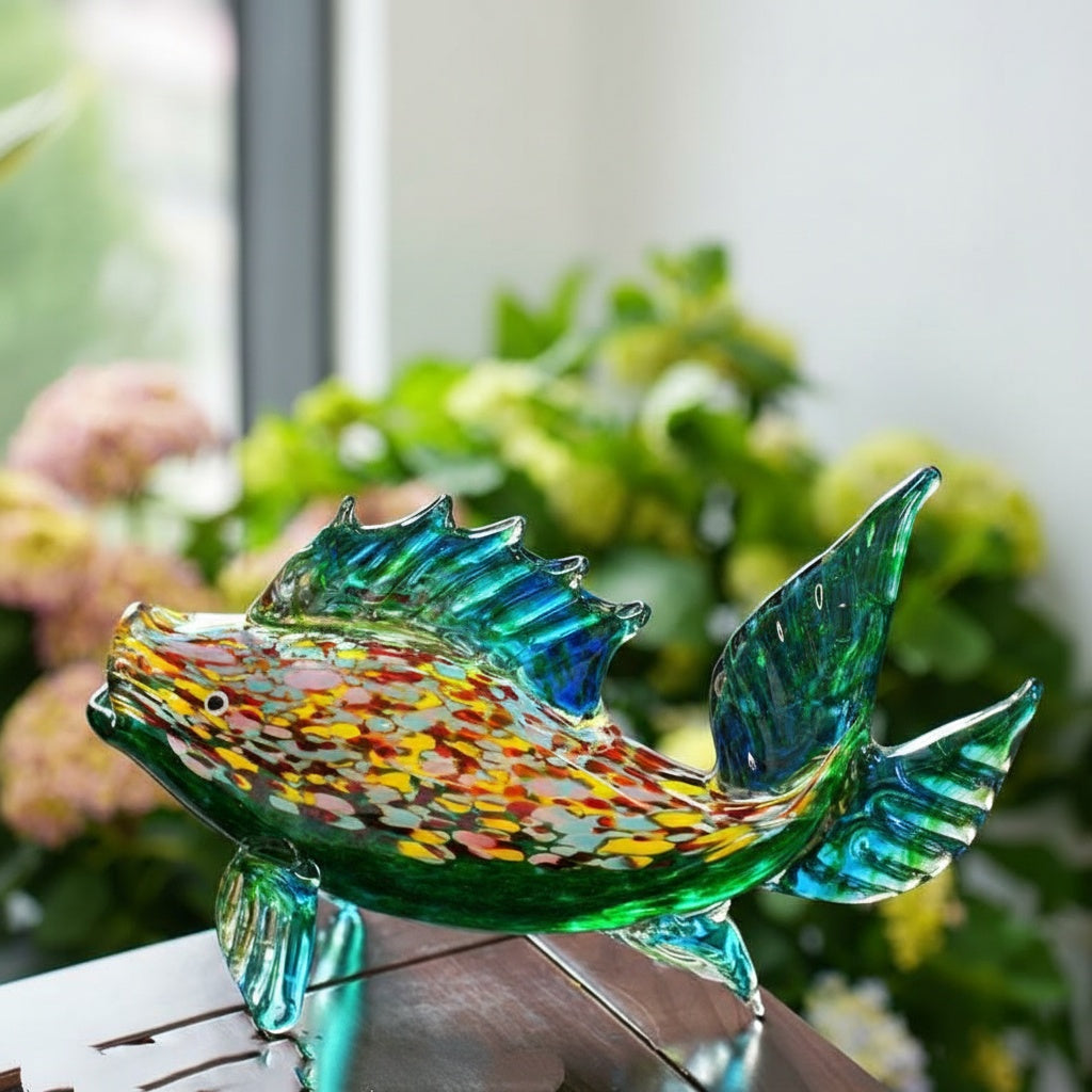 Angled view of glass fish sculpture showing scale details