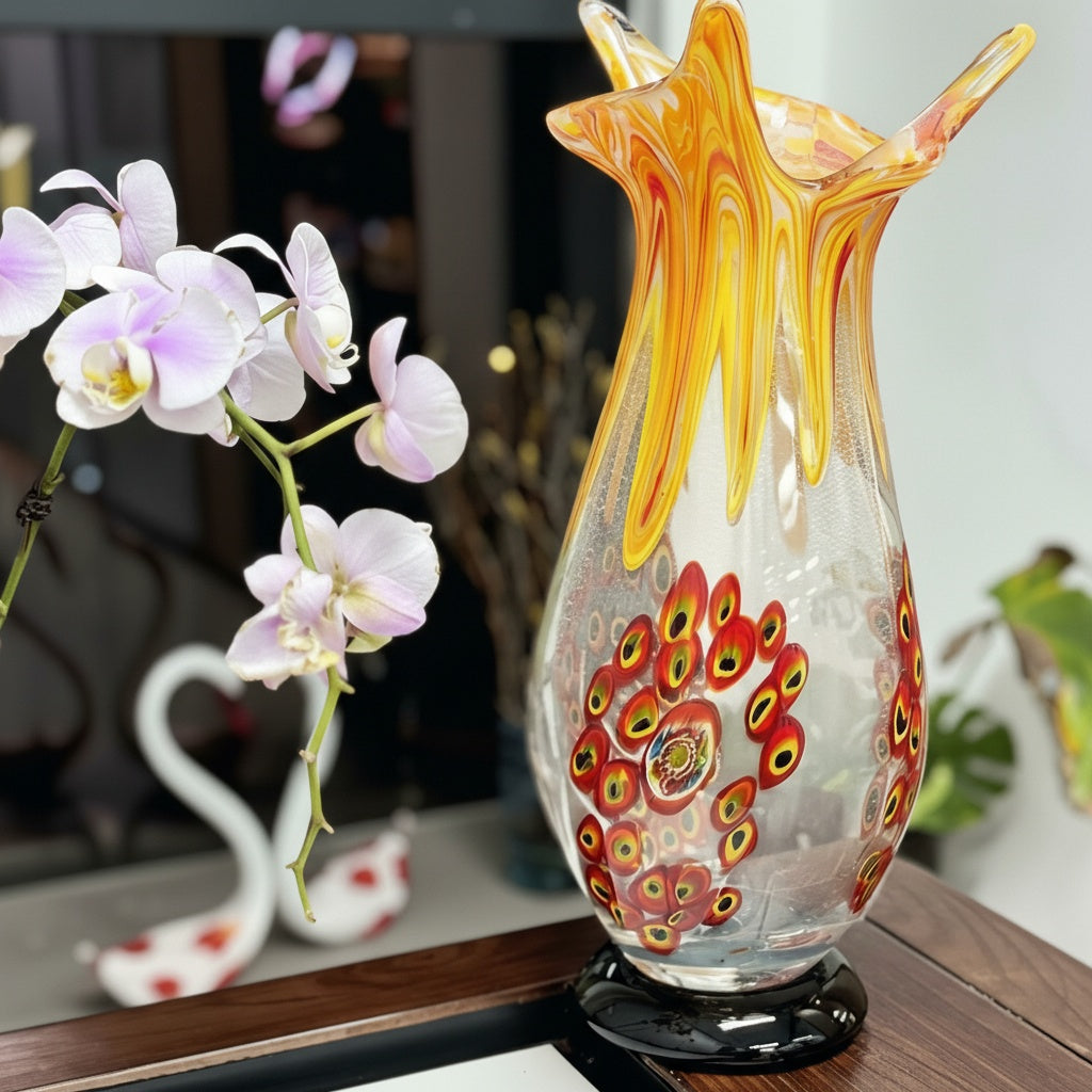 Angled view of fluted glass vase on wooden table near orchids