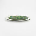 Side view of multicolor art glass platter showing organic rim