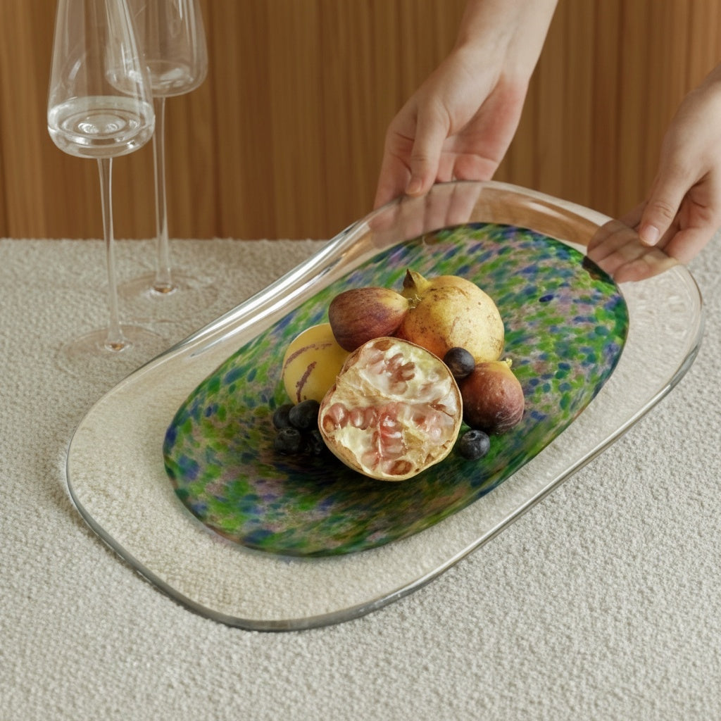 Lifestyle view of glass platter holding fruit on dining table