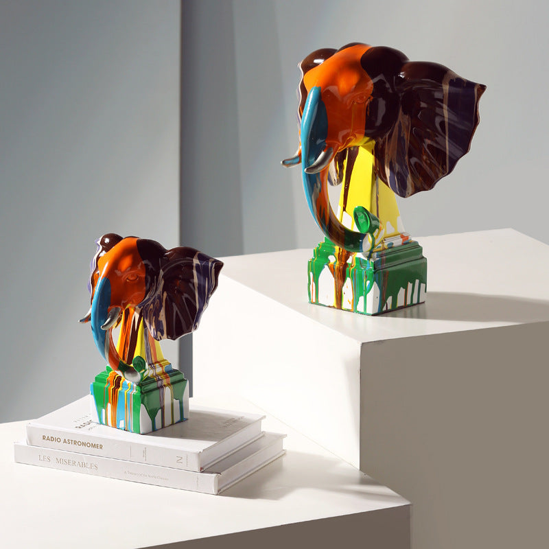 Front view of large and medium multicolor resin elephant sculptures