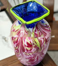 Top angle view of square rim art glass vase with blue neck