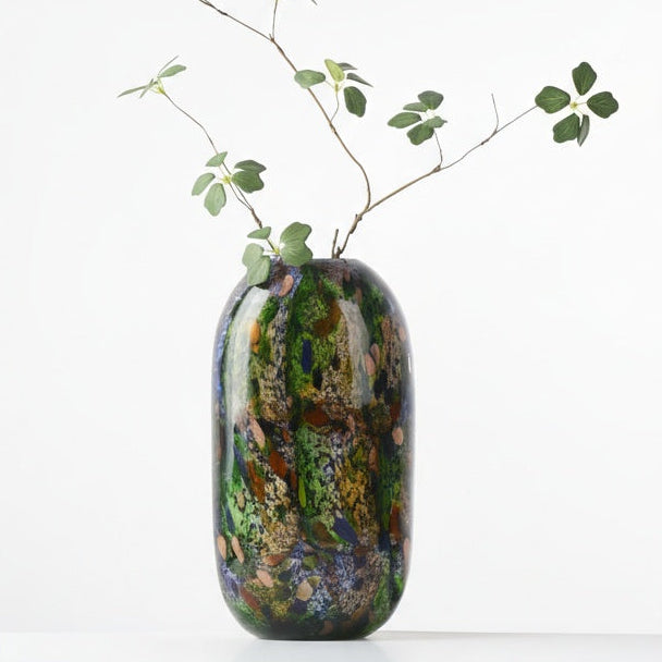 Art glass vase styled with greenery