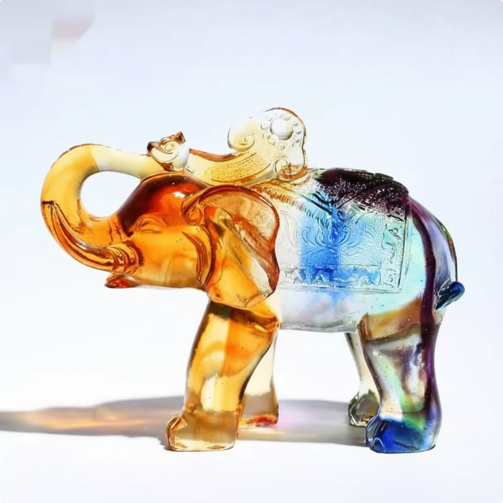 Side profile of multicolored art glass elephant figurine with raised trunk