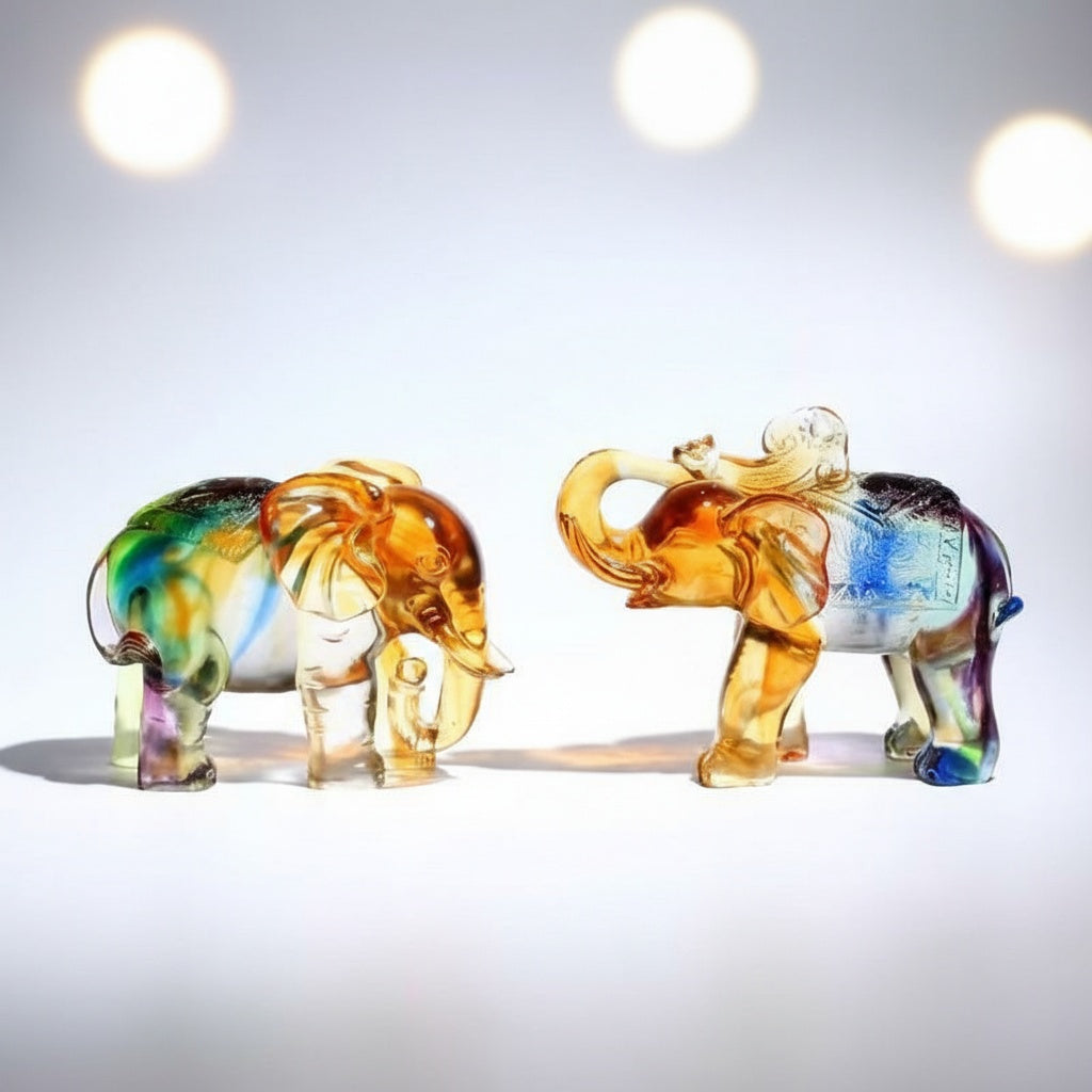 Pair of multicolored art glass elephant figurines facing each other