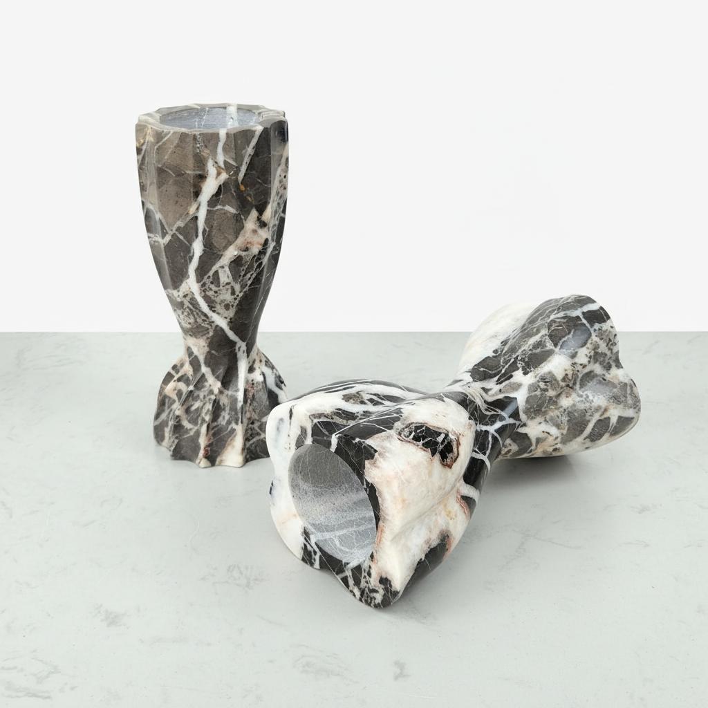 Group shot of gray and white marble candle holders