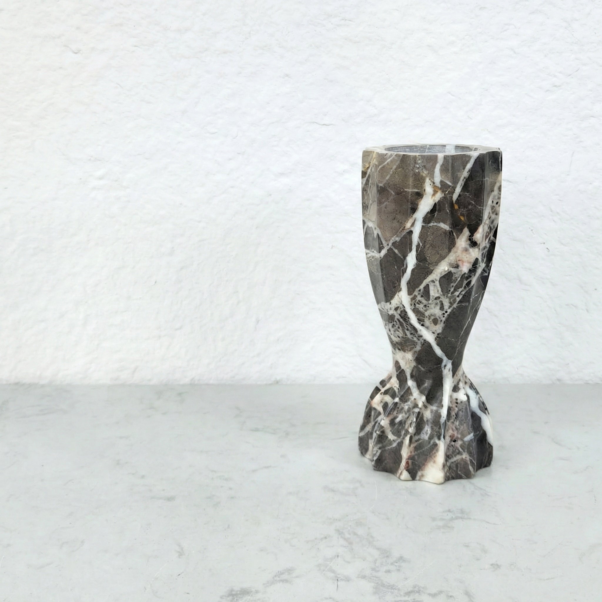 Detail view of dark gray marble candle holder