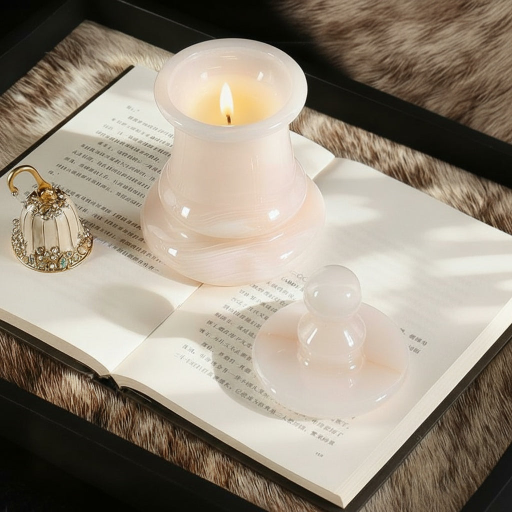 Natural onyx chess pawn candle holder glowing on a book