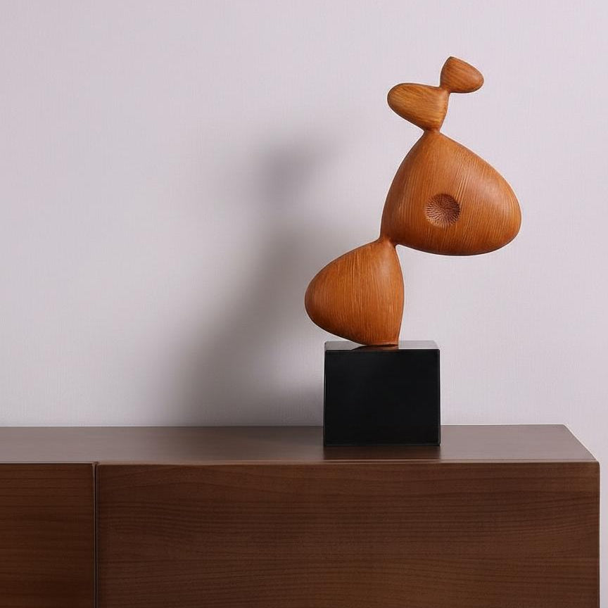 Wood sculpture displayed on wooden console table