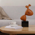 Lifestyle shot of sculpture on coffee table in modern living room