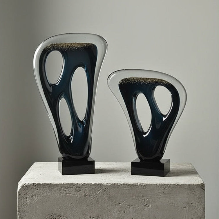 Pair of abstract art glass sculptures on display