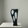 Large tall abstract navy blue glass sculpture