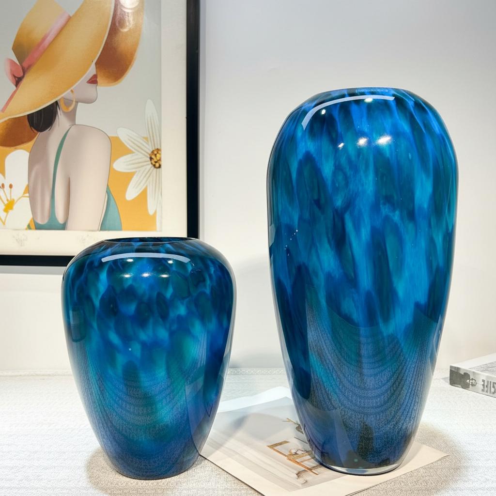 Ocean blue art glass vases set on table