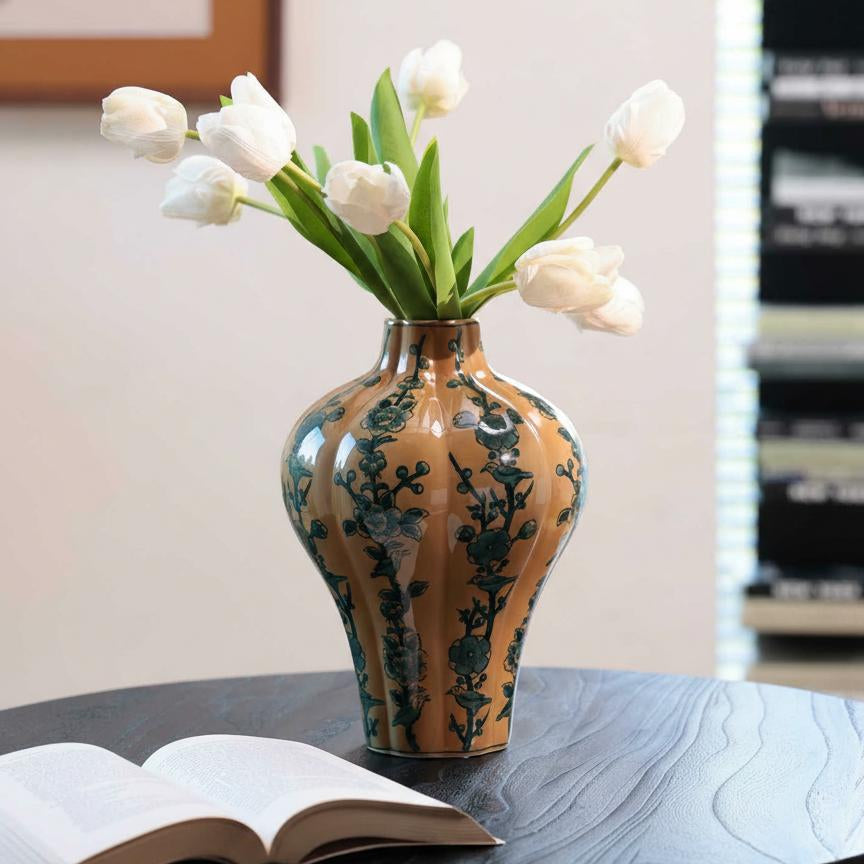 Front view of ochre and blue floral ceramic vase