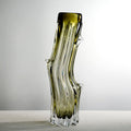 Full view of olive green tree trunk glass vase