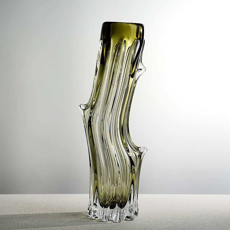 Full view of olive green tree trunk glass vase