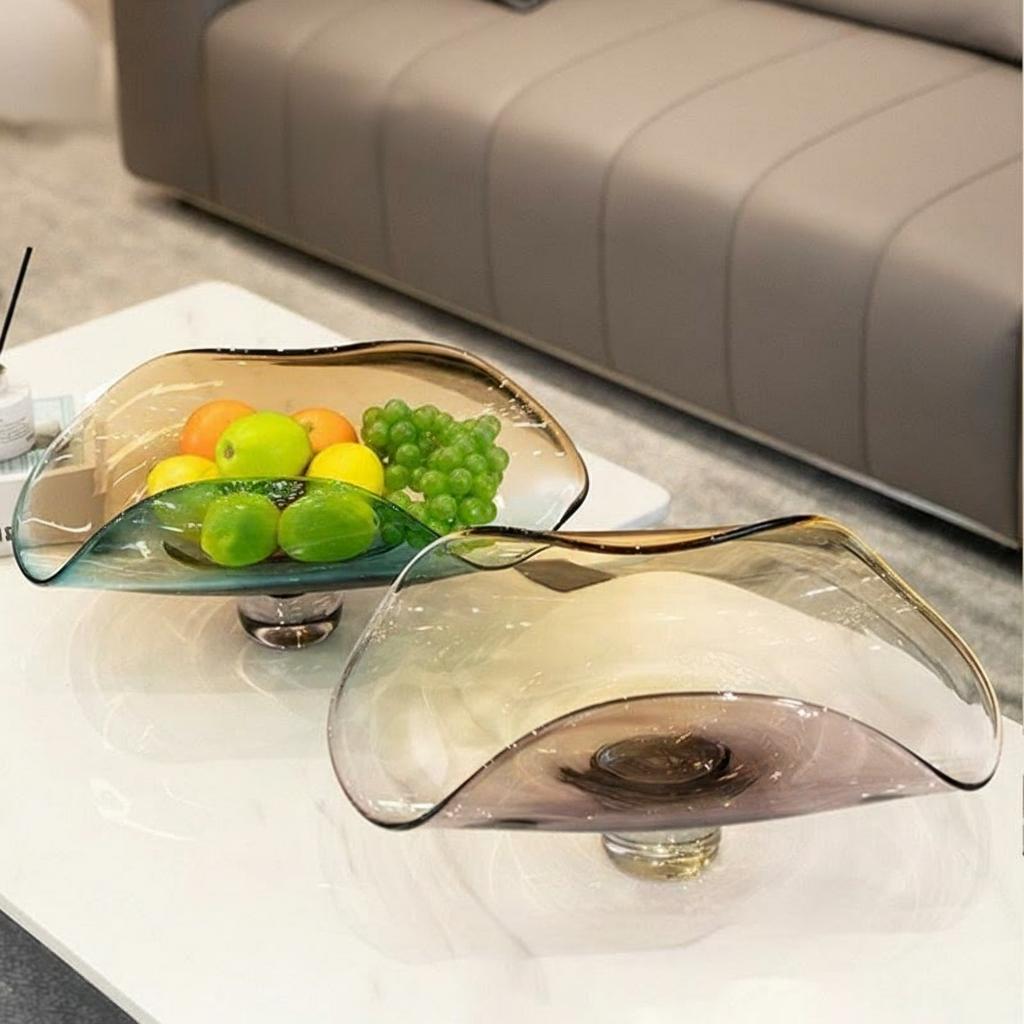 Two ombre glass wave pedestal bowls on coffee table