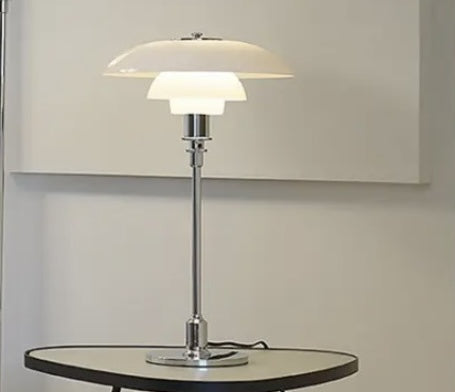 Studio shot of chrome and opal glass table lamp