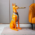 Orange resin geometric Doberman butler statue side view in living room setting