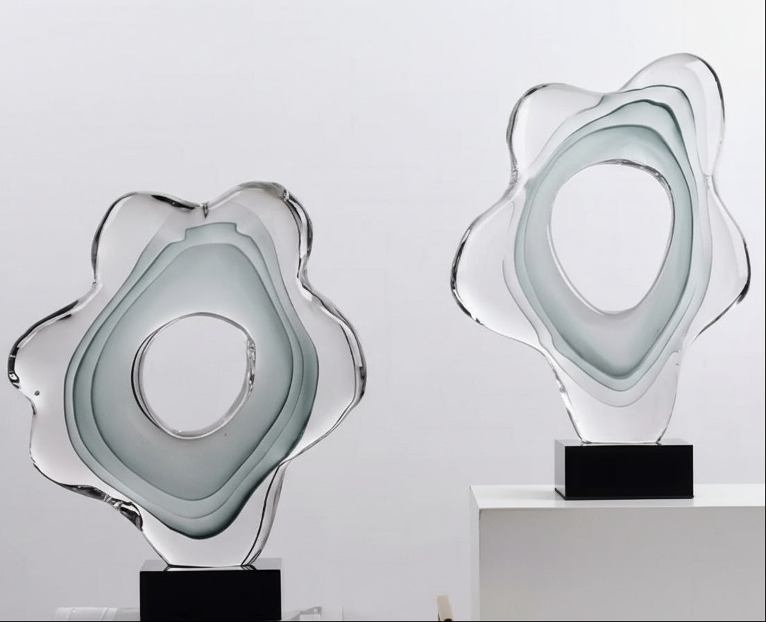 Front view of organic art glass sculpture on black base