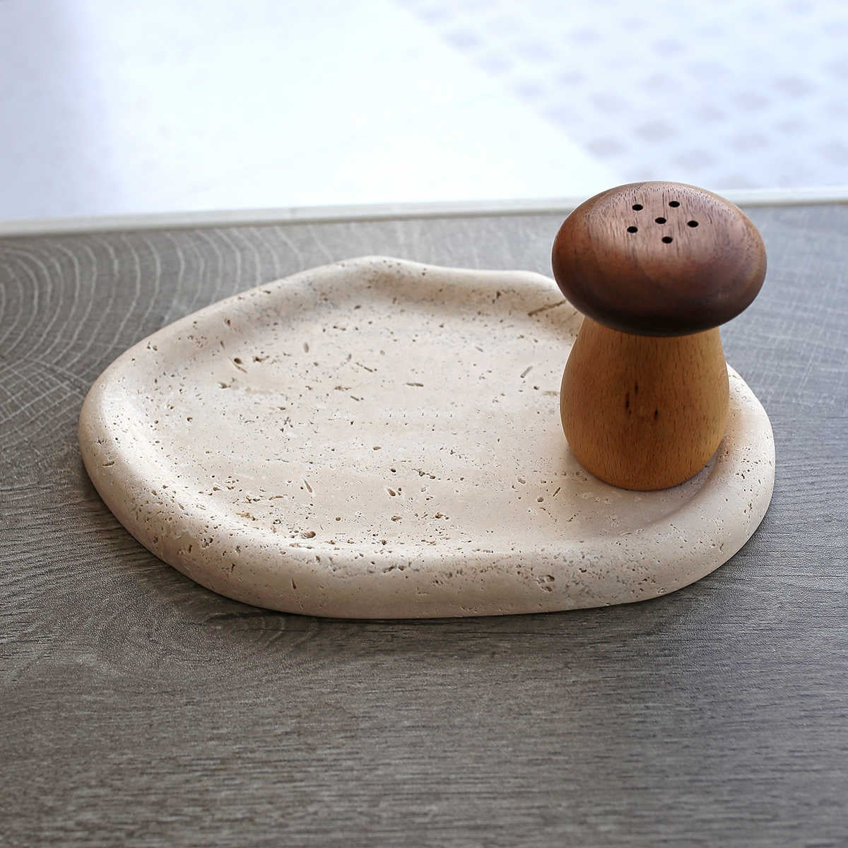 Beige stone tray with wooden mushroom decor