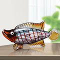 Patterned art glass fish sculpture side view on table