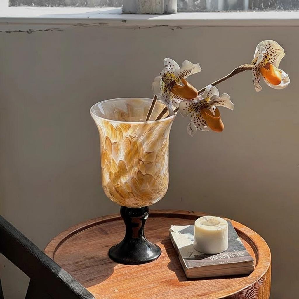 Brown patterned glass vase with spotted orchids