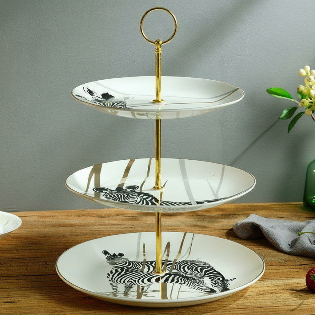 Empty patterned ceramic three tier serving stand with zebra motif