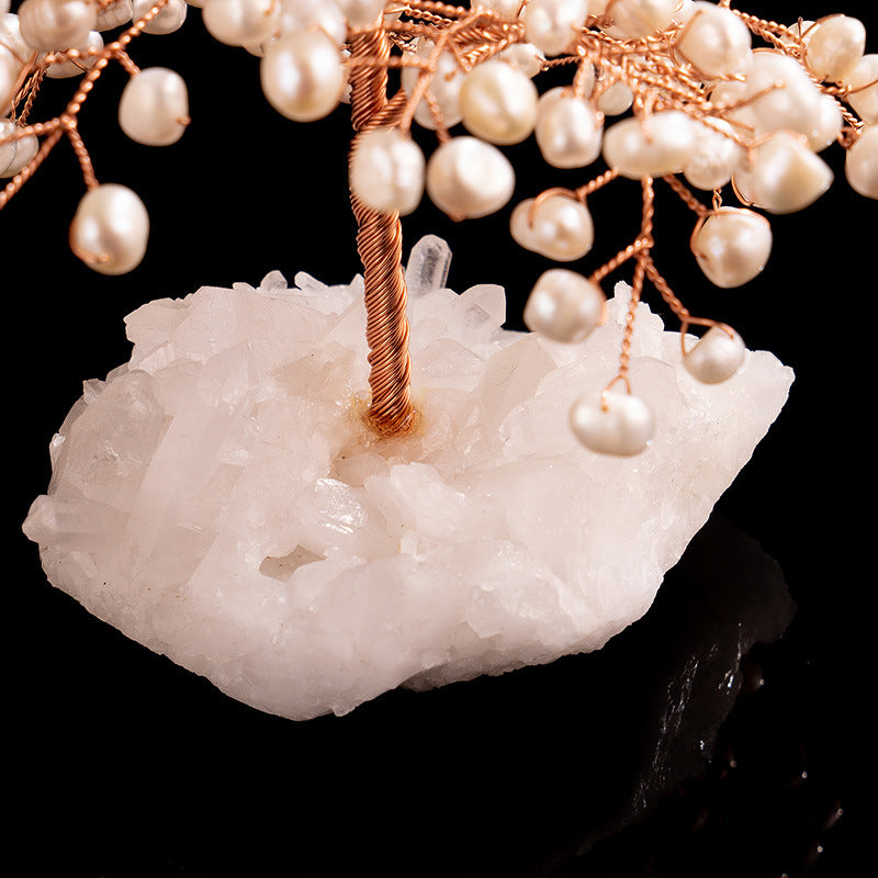 Detail of copper wire trunk and raw crystal base