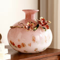 Pink art glass vase with enamel flower detail front view