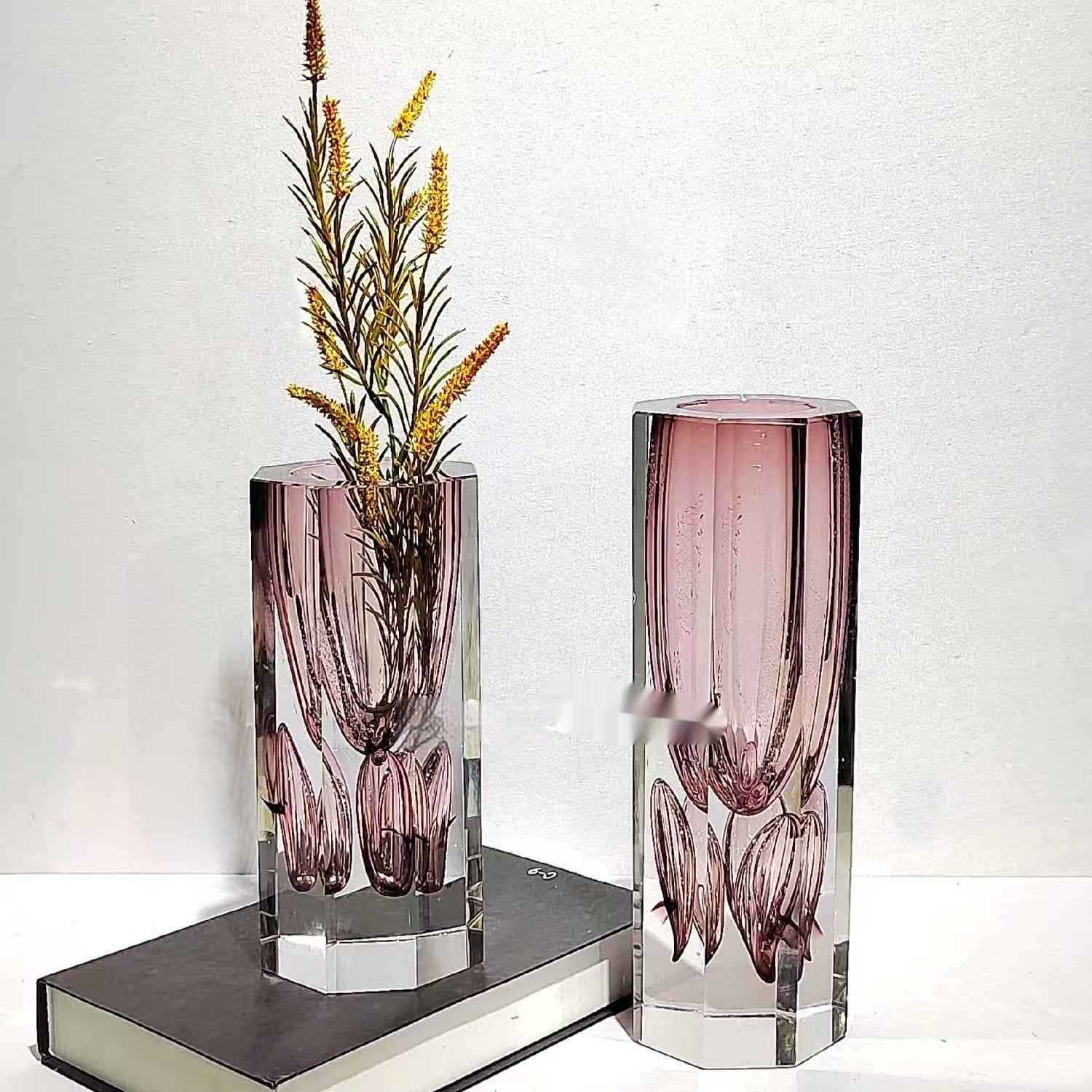 Styled shot of tall and medium hexagonal glass vases