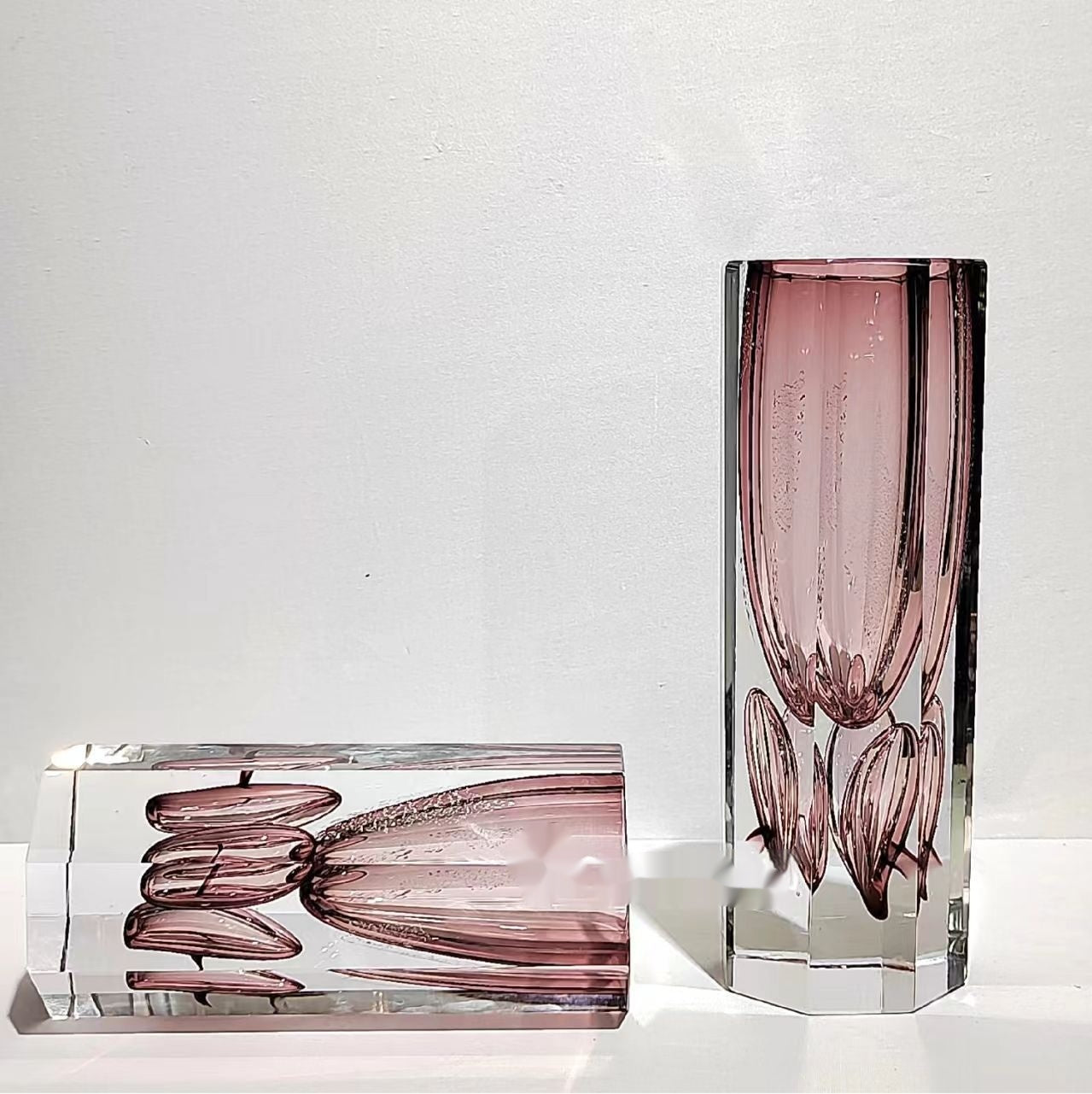 Close up detail of pink glass encased in clear hexagonal prism