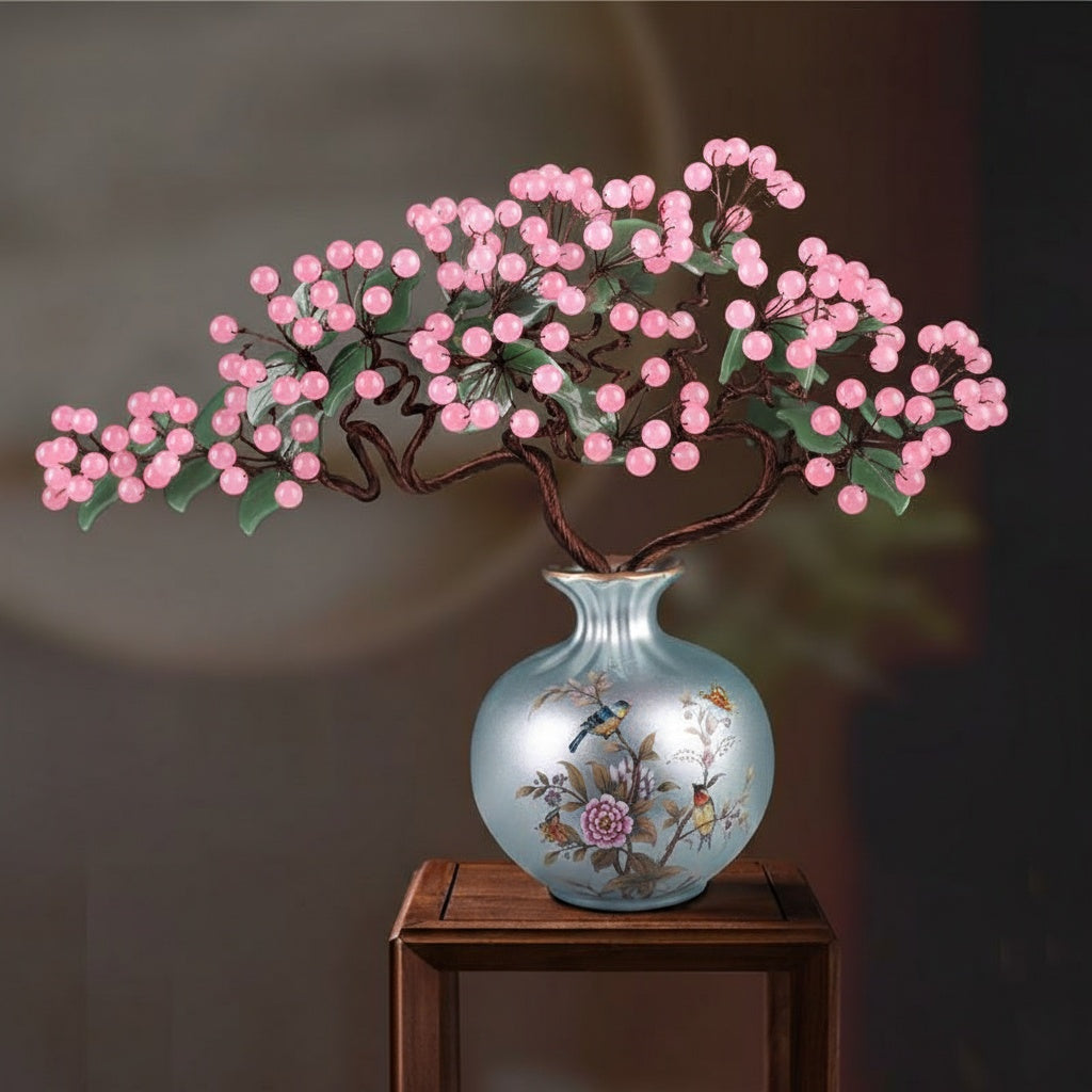 Front view of pink crystal bonsai in blue porcelain vase