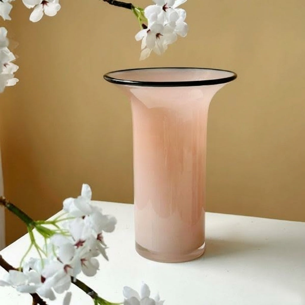 Pink glass flared vase with cherry blossoms