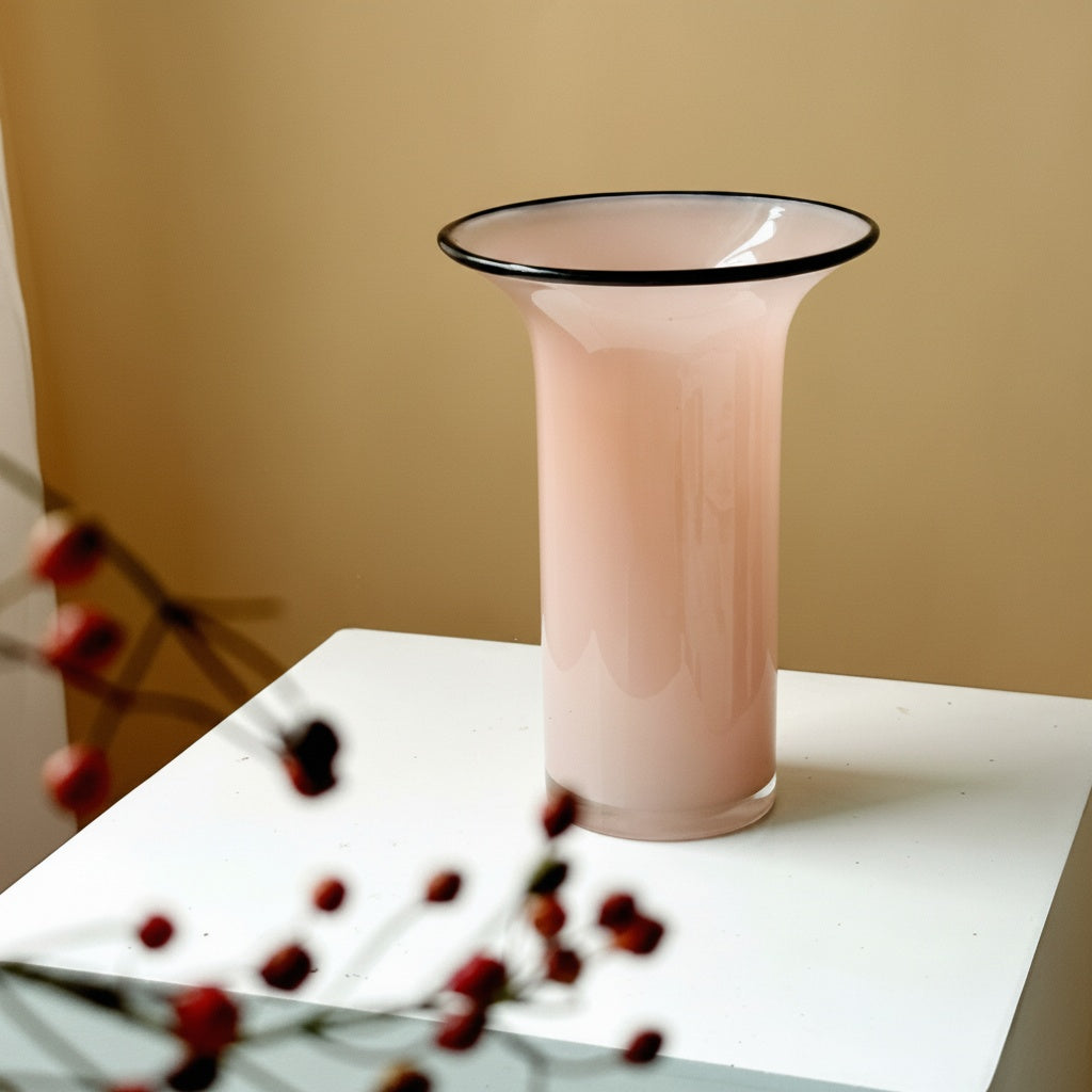 Pink glass flared vase with dark rim detail