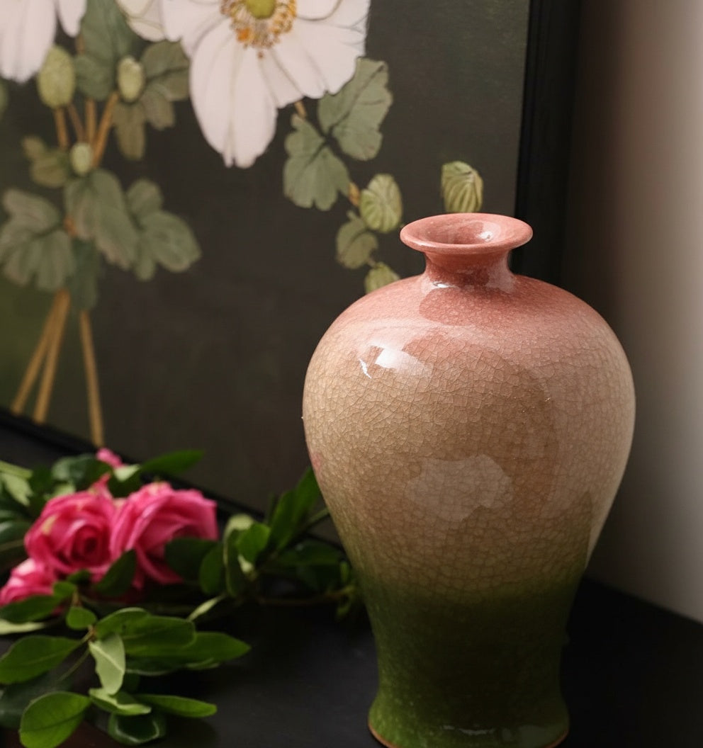 Close up of pink and green glazed ceramic vase neck