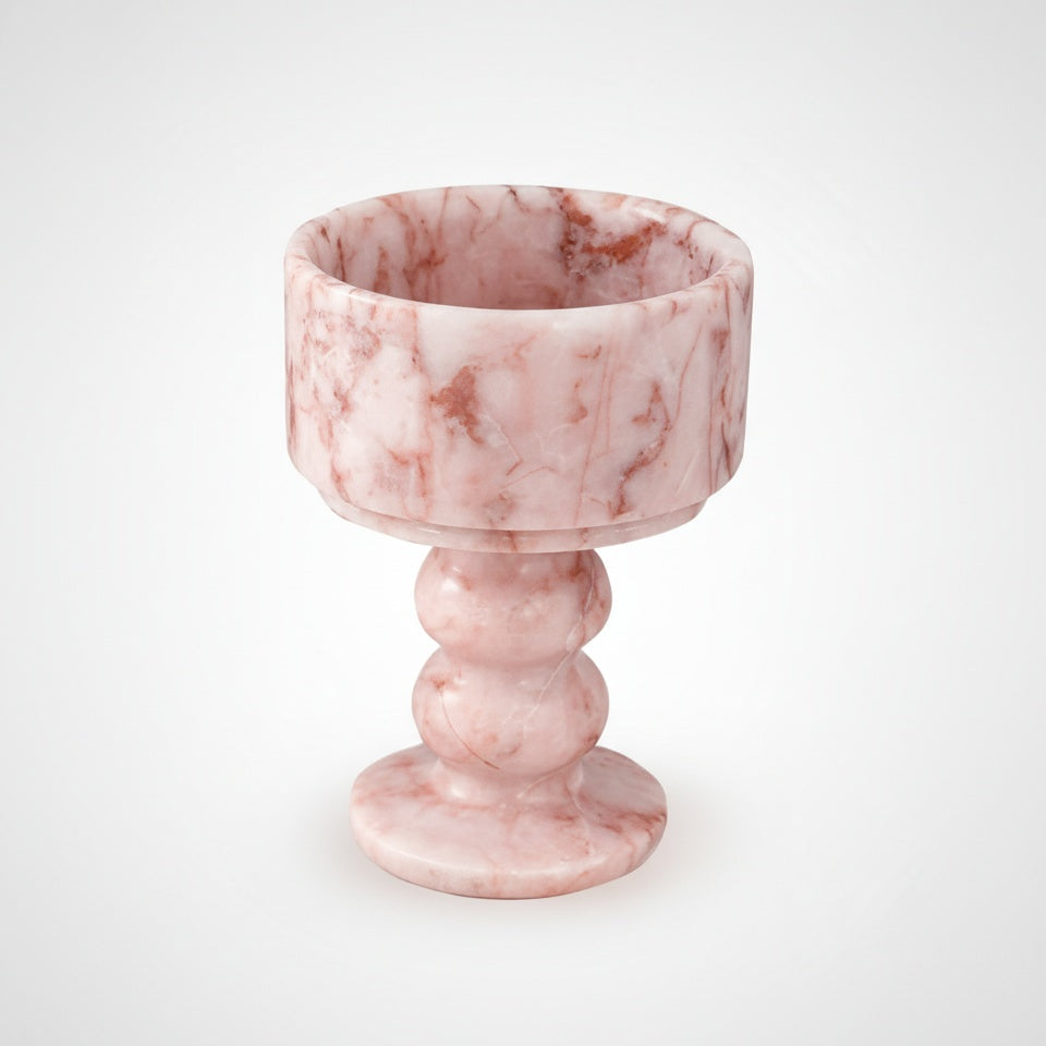 Studio shot of pink marble pedestal candle holder