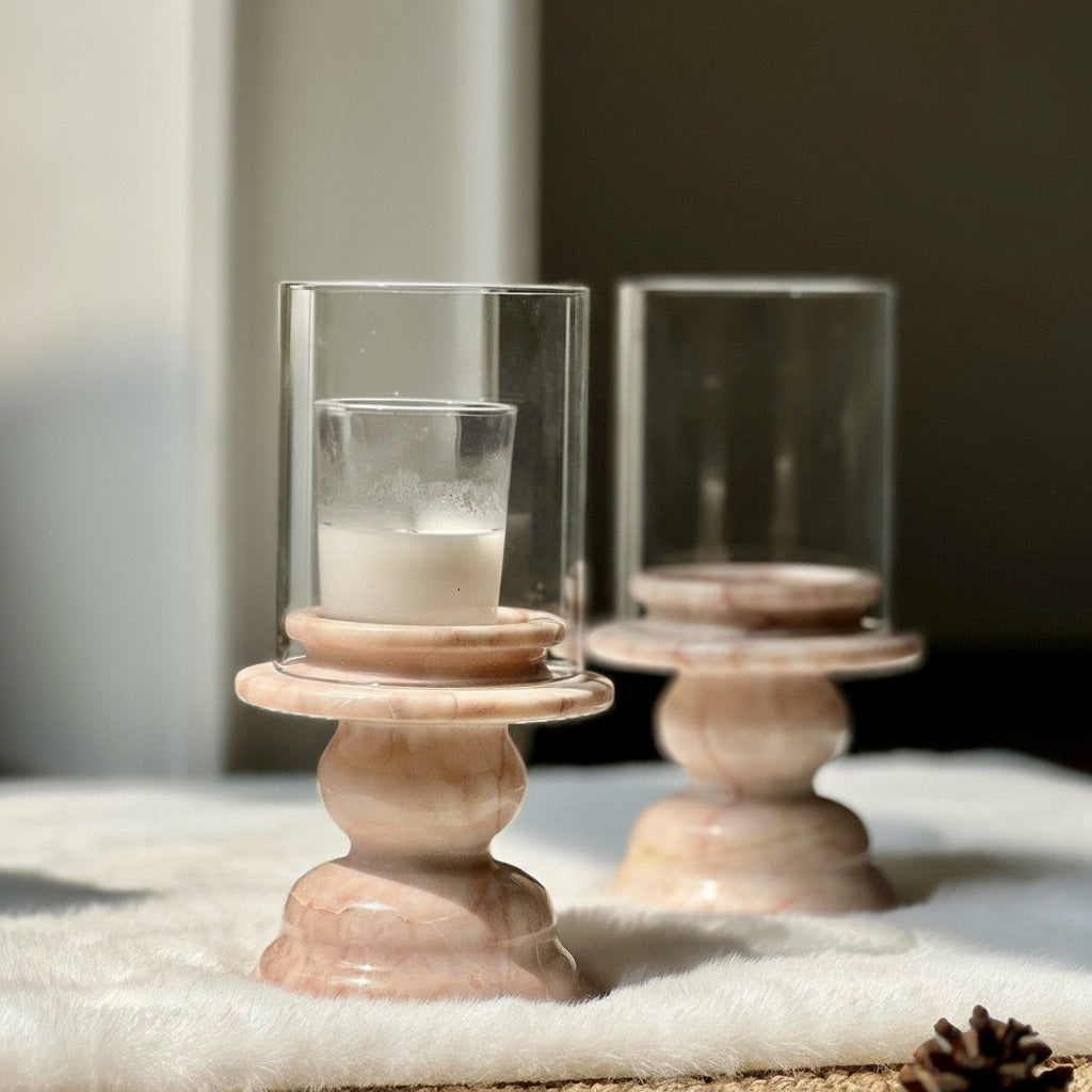 Pink marble pedestal candle holder with glass sleeve front view