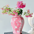 Pink porcelain hexagonal temple jar with floral arrangement