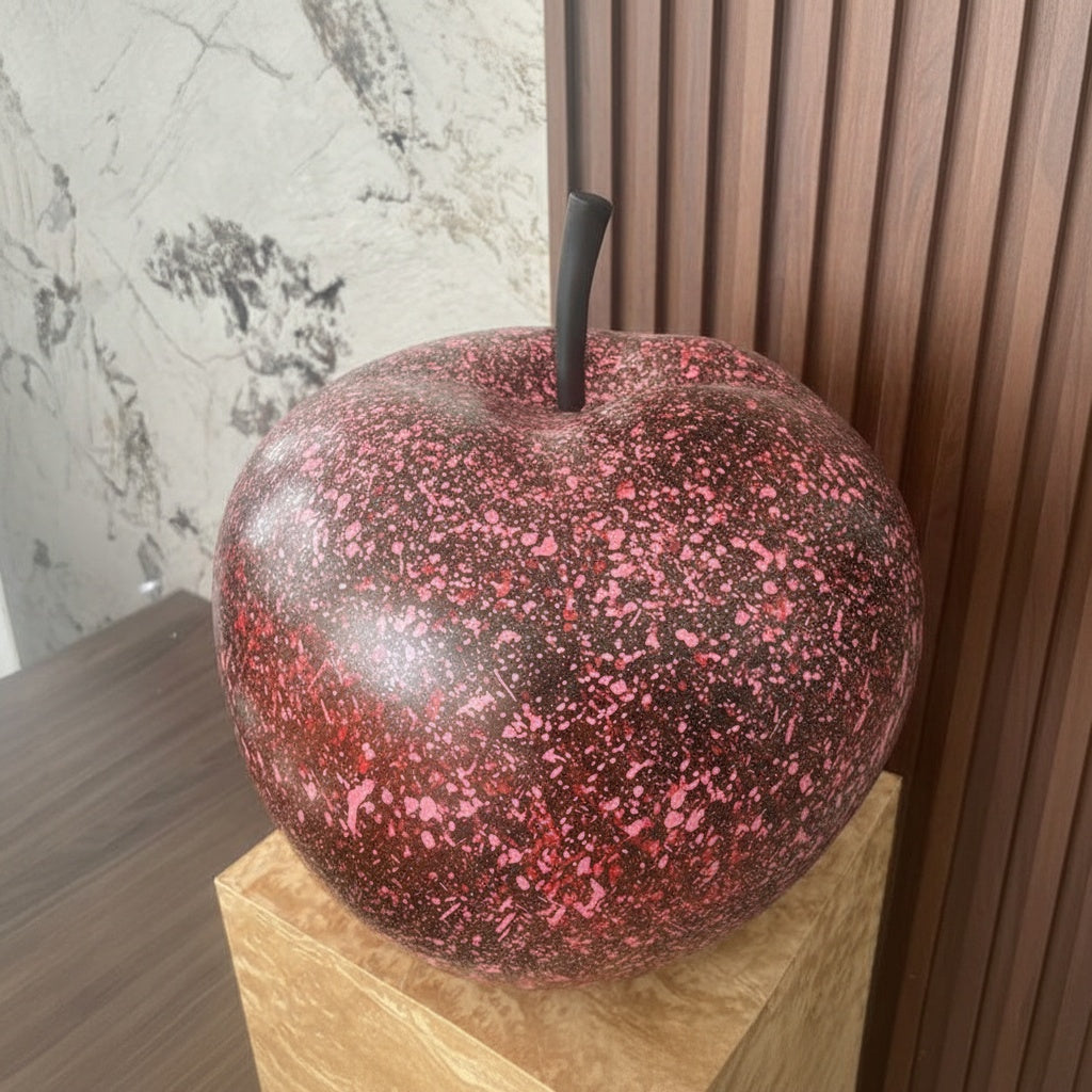 Pink splatter resin apple sculpture side angle