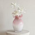 Pink to white ombre glass vase with white lilies