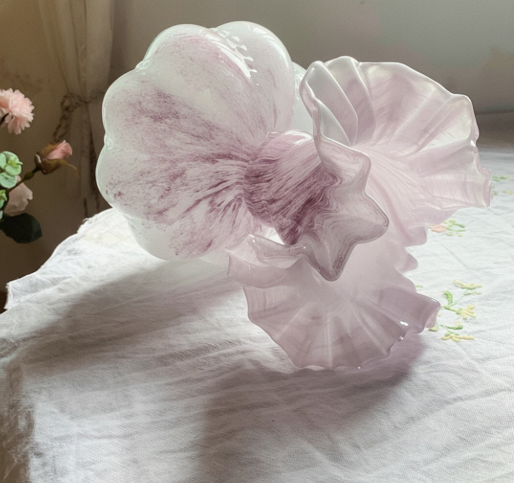 Detail of ruffled glass rim and pink swirl pattern