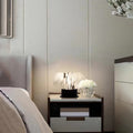 Pleated resin wave table lamp on bedside table luxury bedroom context