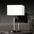 Front view of polished chrome rectangular table lamp with white shade